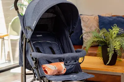 a baby stroller sitting in front of a table at Loma Verde Aparthotel in Medellín