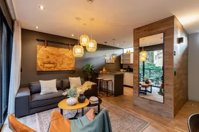 a living room with a couch and a table at Loma Verde Aparthotel in Medellín