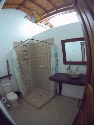 a bathroom with a shower and a sink and a toilet at Casa Republicana en Jericó in Jericó