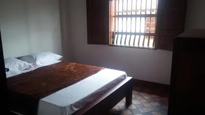 a bedroom with a bed and a window in a room at Casa Republicana en Jericó in Jericó