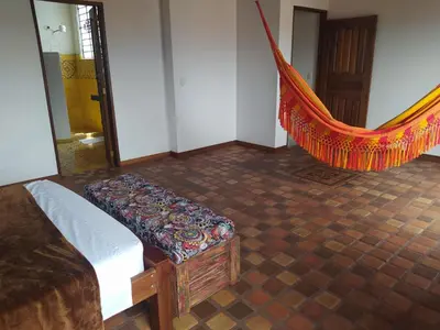 a room with a bed and a hammock in it at Casa Republicana en Jericó in Jericó