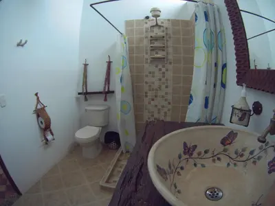 a bathroom with a bath tub and a toilet at Casa Republicana en Jericó in Jericó