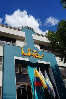 a hotel with a sign on the side of a building at Hotel Lukas in Medellín