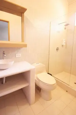 a bathroom with a toilet and a sink and a shower at La Iguana de Santa Fe by Bernalo Hotels in Santa Fe de Antioquia