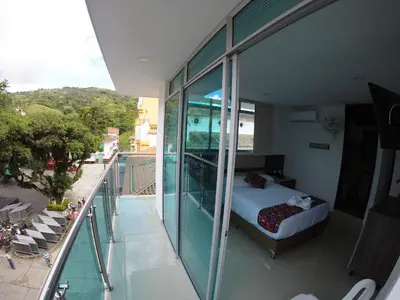 a room with a bed on a balcony at Hotel La Roca San Rafael in San Rafael