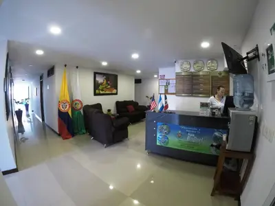 a woman standing at a counter in a room at Hotel La Roca San Rafael in San Rafael