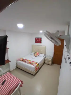 a small bedroom with a bed in a room at Hotel San Fernandos Plaza in San Rafael