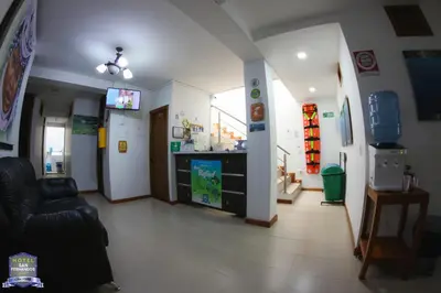 a living room with a tv and a couch at Hotel San Fernandos Plaza in San Rafael