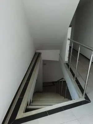 a stairway in a building with a stair case at Hotel America 52 in Rionegro