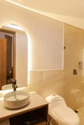 a bathroom with a sink and a toilet at Hotel Lincoln in Medellín