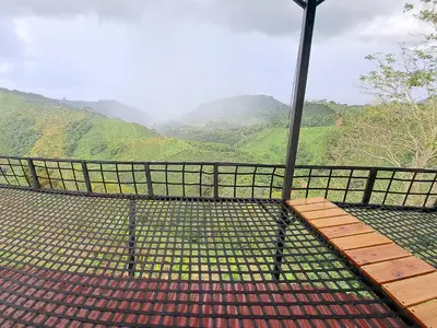 a viewing platform with a view of a mountain at Finca Campestre Villa del Campo in Santa Rosa de Cabal