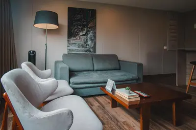 a living room with a couch and a table at Sites Hotel in Medellín