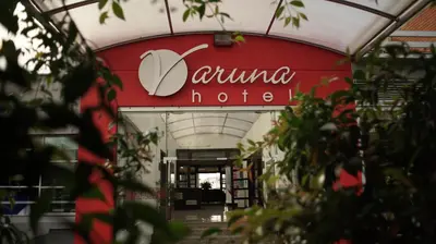 a building with a sign that reads comino hotel at Hotel Varuna in Manizales