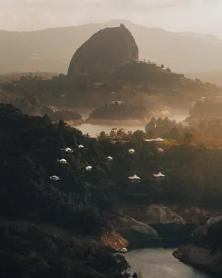 a view of a valley with a mountain and a river at Bosko in Guatapé