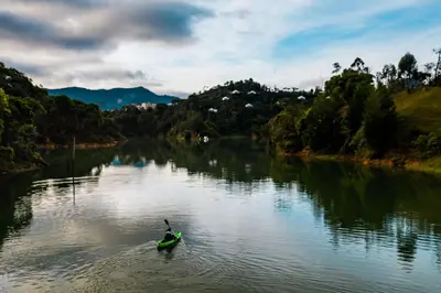 a person in a kayak on a river at Bosko in Guatapé