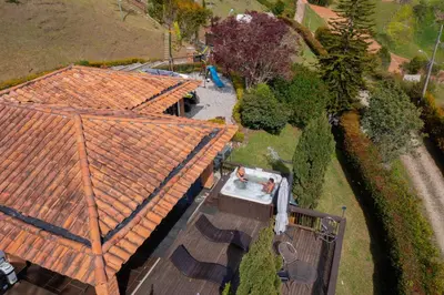 an overhead view of a house with orange roofs at CASA CAMPESTRE MONTECARLO Guatapé- desayuno a pareja in Guatapé