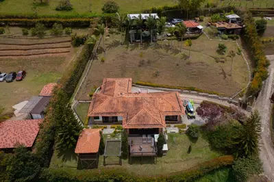 an aerial view of a house with a roof at CASA CAMPESTRE MONTECARLO Guatapé- desayuno a pareja in Guatapé