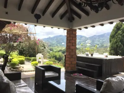 a living room with a view of the mountains at CASA CAMPESTRE MONTECARLO Guatapé- desayuno a pareja in Guatapé