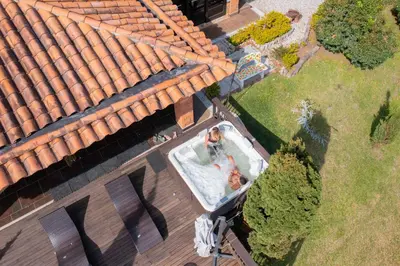 an overhead view of a man in a swimming pool on a house at CASA CAMPESTRE MONTECARLO Guatapé- desayuno a pareja in Guatapé