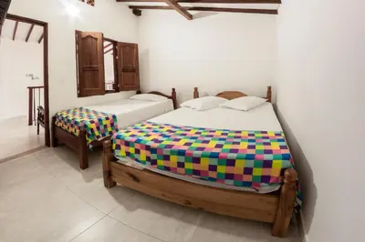 a bedroom with two beds in a room at Vivienda turística mi sueño Jardín in Jardin