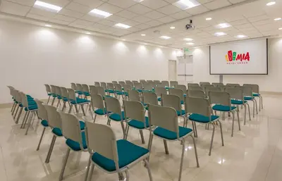 a room with chairs and a screen in it at Mia Hotel Choco in Quibdó