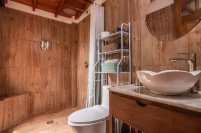 a bathroom with a sink and a mirror at Serendipity Hospedaje Boutique in Guatapé
