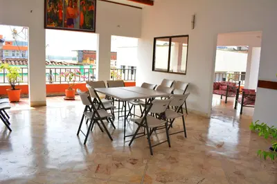 a dining room with a table and chairs at Hotel Tayrona in Puerto Berrío