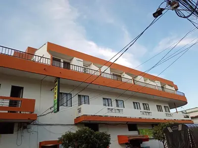 a building with a balcony on the side of it at Hotel Tayrona in Puerto Berrío