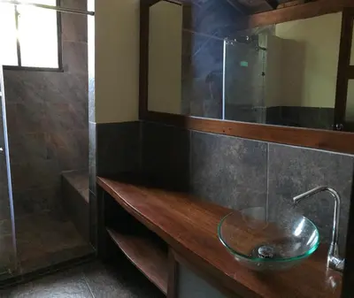 a bathroom with a sink and a shower at Ritmo del Rio in San Rafael