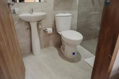 a bathroom with a toilet and a sink at Hotel Sie7e in Medellín