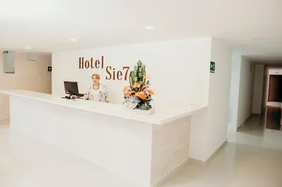 a lobby of a hotel with a reception desk at Hotel Sie7e in Medellín