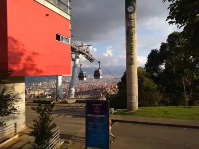 a clock tower with a view of a city at Apartamento Campestre Medellin in Medellín