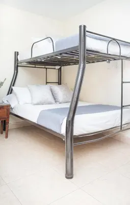a bunk bed in a room with a bunk bed frame at Hotel Conquistadores in Medellín