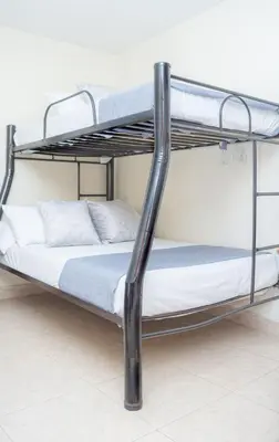 a bunk bed in a room with a bunk bed frame at Hotel Conquistadores in Medellín