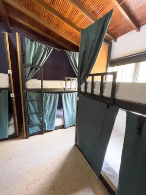 a room with two bunk beds with a canopy at Rock Hostel Medellin in Medellín