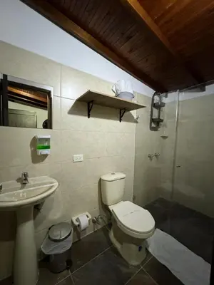 a bathroom with a toilet and a sink at Gemas San Joaquin 1 in Medellín