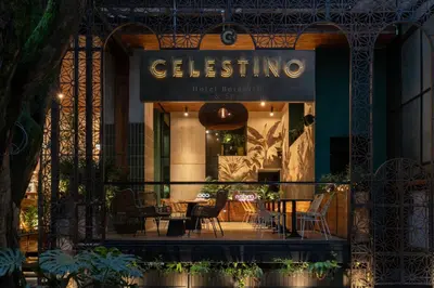 a store front of a restaurant with a table and chairs at Celestino Boutique Hotel & Spa in Medellín