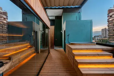 a balcony of a building with wooden steps at Celestino Boutique Hotel & Spa in Medellín