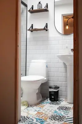 a bathroom with a toilet and a sink at ADN Algo de Nosotros - Malaika in Medellín