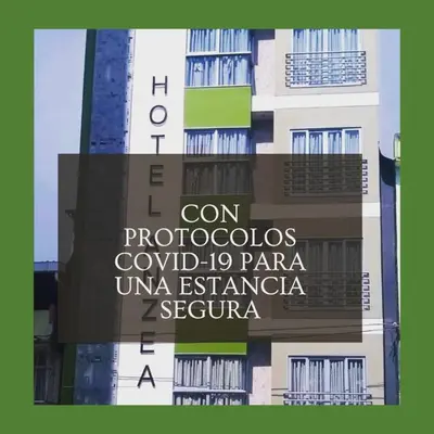 a building with a sign on the side of it at Hotel Anzea in Anserma