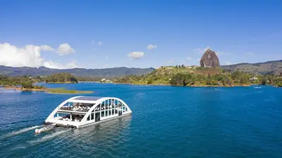a boat in a large body of water at Hotel Los Recuerdos in Guatapé