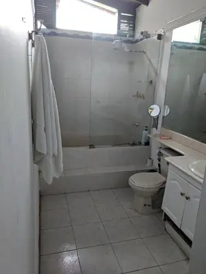 a bathroom with a tub and a toilet and a sink at Casa Finca Paititi in San Antonio de Pereira