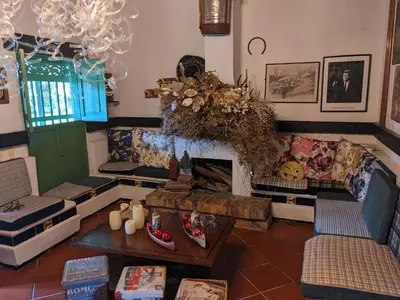 a living room with a couch and a fireplace at Casa Finca Paititi in San Antonio de Pereira