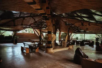 a large room with tables and chairs in it at Ecohotel Tierra de Agua in Cocorná