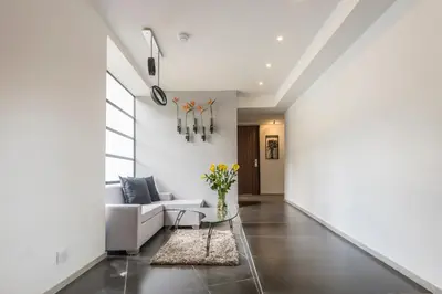 a living room with a couch and a table at Foresta Hotel in Medellín