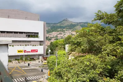 a view of a city with a mountain in the background at Casa Entera-Cerca a Mall La Central y Estación de Tranvía in Medellín