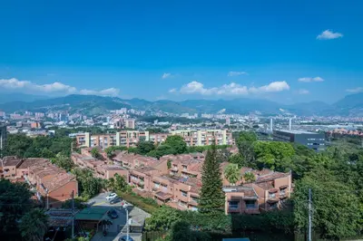 a city with buildings and mountains in the background at Aptos Alcazar Oviedo By HOUSY in Medellín