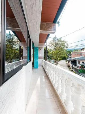 a view from the balcony of a building with white railing at Hotel Jireh - San Carlos Ant in San Carlos