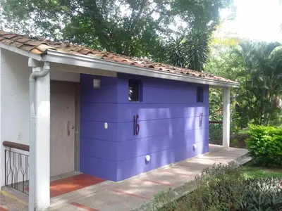 a purple garage with a roof at Hotel el Tesoro in San Jerónimo