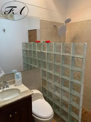 a bathroom with a toilet and a sink at Finca Alejandria in Guatapé